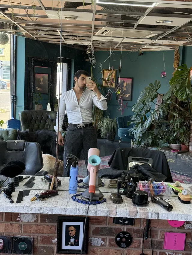 Inside Ether Cut: the chair, plants and motorbike